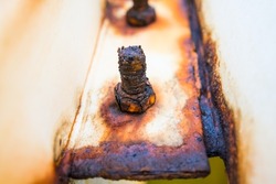 Close-up of corroded steel nuts, corrosion of steel, general corrosion, offshore petroleum beam lines.