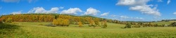 panorama landscape with meadows and trees in autumn