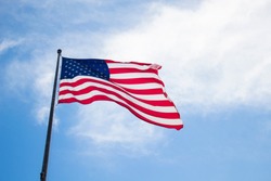 photo to the united state flag moving with the wind