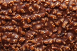 Chocolate texture. Сhocolate with nuts. Сlose-up.