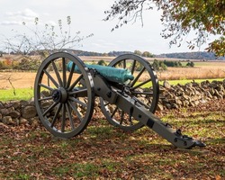 A Confederate civil war cannon on West Confederate Avenue at the Gettysburg National Military Park on a sunny fall day