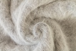 Swirl of gray alpaca fabric and mohair wool sweater texture