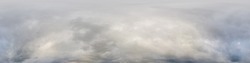 Sky panorama on overcast rainy day with low clouds in seamless spherical equirectangular format. Complete zenith for use in 3D graphics, game and for aerial drone 360 degree panorama as a sky dome