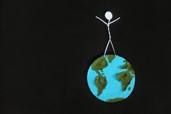 Human stick figure standing on top of planet earth in dark black background. Man top of the world, conquer, dominance and most influential people concept.