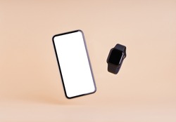 smart phone and smart watch on cream color background