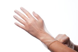 Female hands using vinyl gloves