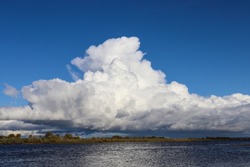 Large white cumulonimbus cloud, thunderstorm