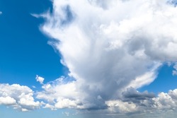 White cumulonimbus clouds against the blue sky