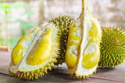 Durian riped and fresh ,durian peel with yellow colour on wooden table.