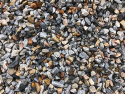 Stone gravel wall for gray color gravel or rock background and texture.