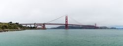View of Golden Gate Bridge in SanFrancisco, a day of clouds and thick fog