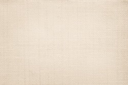 Jute hessian sackcloth canvas woven texture pattern background in light beige cream brown color blank empty