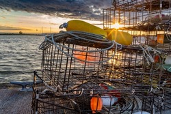 Crab cages on the Everett Marina dock. In background, sunsets over Jetty Island