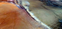 abstract landscape photo of the deserts of Africa from the air emulating the shapes and colors of coronary artery, Genre: Abstract naturalism, from the abstract to the figurative