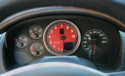 dashboard speedometer sport car closeup red 