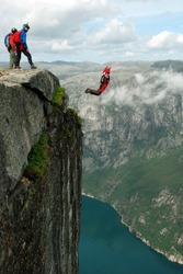 BASE jump off a cliff.