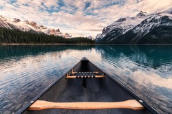 Canoeing with Canadian Rockies in Spirit Island on Maligne Lake at Jasper national park, Canada