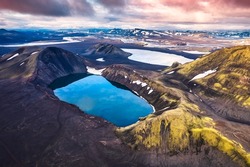 Aerial view of Hnausapollur or Bláhylur volcano crater with blue pond on Icelandic highlands in the sunset on summer at Iceland