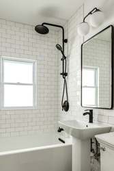 Vintage White Bathroom with Pedestal Sink and Subway Tile and Black Matte Fixtures