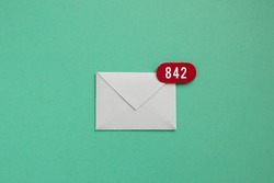 Inbox over load - envelope with red app notification bubble badge showing there are 842 unread emails waiting to be answered