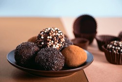 Traditional brazilian sweet chocolate ball Brigadeiro made with cocoa powder and condensed milk