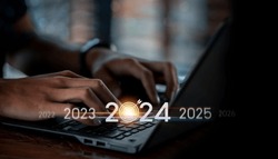 Trend of 2024. people business investor using laptop with virtual 2024 year diagram, business trend, change from 2023 to 2024, strategy, investment, business planning and happy new year concept