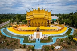 A top view from a drone of the temple building is shaped like a traditional Thai boat at Wat Tha Makok, Rayong, Thailand.