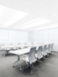 Meeting room, brightly lit office with blurred bokeh effect. vertical photo. copy space. High quality photo