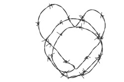 Barbed wire in the form of a heart on a white isolated background,