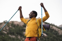 African American man, trekking mountaineer arrives at his destination. Adventurer And Traveler For Life
