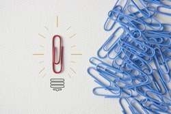  Business minimal concept as a group of paperclip on canvas with one individual in the opposite direction.