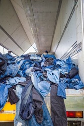 Ella, Sri Lanka Imported second hand jeans from Canada are stacked high in a truck and displayed for bargain sale in a charity scheme.