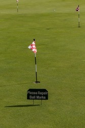 Stockholm, Sweden A putting green at a golfcourse and a sign saying: 
