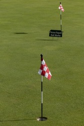 Stockholm, Sweden A putting green at a golfcourse and a sign saying: 