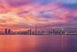 Stunning view of Dubai skyline  with warm Pastel Sunrise colors