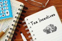 Conceptual photo about Tax Incentives with handwritten text.