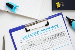 Financial concept about UNIT LINKED INSURANCE with sign on the business paper 