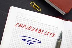 Conceptual photo about EMPLOYABILITY with handwritten text. Employability refers to your ability to gain initial employment, maintain. employment, and obtain new employment if required