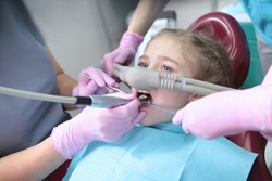 Dental treatment in a child with the use of nitrous oxide. Relaxation of the patient before surgical or dental procedures. Children's modern dentistry. The concept of healthcare. 