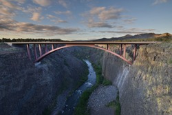 Sunset bridge over a canyon and a river at Peter Skene Ogden State scenic viewpoint in Oregon, United States of America (USA). HDR . 