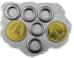 DIN 125 washers close up isolated on stainless steel background with EURO cents coins to compare size