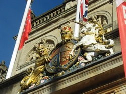 Court insignia and emblem of the lion and the unicorn protected by fine metal mesh