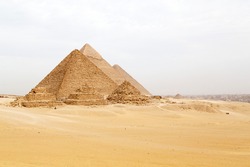 Pyramids on the Giza Plateau at Cairo, Egypt. The ancient structures form part of the Memphis and its Necropolis – the Pyramid Fields from Giza to Dahshur UNESCO World Heritage Site.