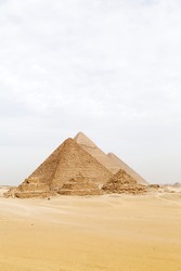 Pyramids on the Giza Plateau at Cairo, Egypt. The ancient structures form part of the Memphis and its Necropolis – the Pyramid Fields from Giza to Dahshur UNESCO World Heritage Site.