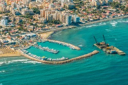 Sea port city of Larnaca, Cyprus.  View from the aircraft to the coastline, beaches, seaport and the architecture of the city of  Larnaca.