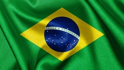 Close up realistic texture fabric textile silk satin flag of Brazil waving fluttering background. National symbol of the country. 7th of September, Happy Day concept
