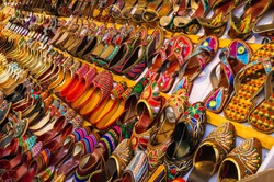 Collection of colorful ethnic shoes at marketplace in India