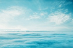 Blue sky with some clouds. View over the clouds.ummer blue sky cloud gradient light white background. Beauty clear cloudy in sunshine calm bright winter air bacground. Gloomy vivid cyan landscape in e