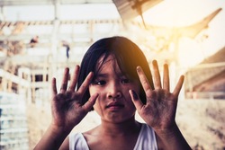 Dirty hands of children from construction work. World Day Against Child Labour concept.