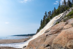 Beautiful panorama of the Grand-Sault Waterfall flowing into the Saint-Lawrence river in La Minganie, Quebec, Canada